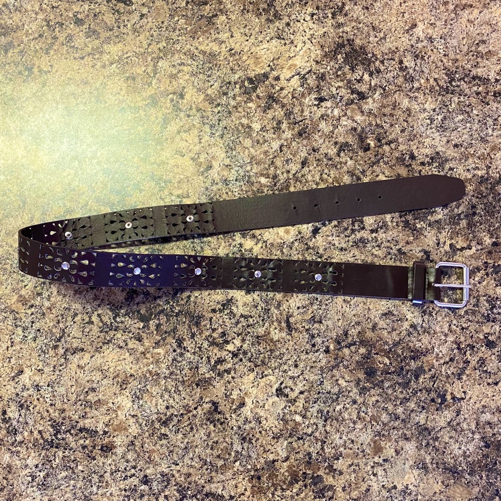 Brown designed belt with silver holes